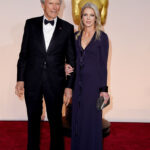 Director Clint Eastwood and Christina Sandera attend the 87th Annual Academy Awards on February 22, 2015