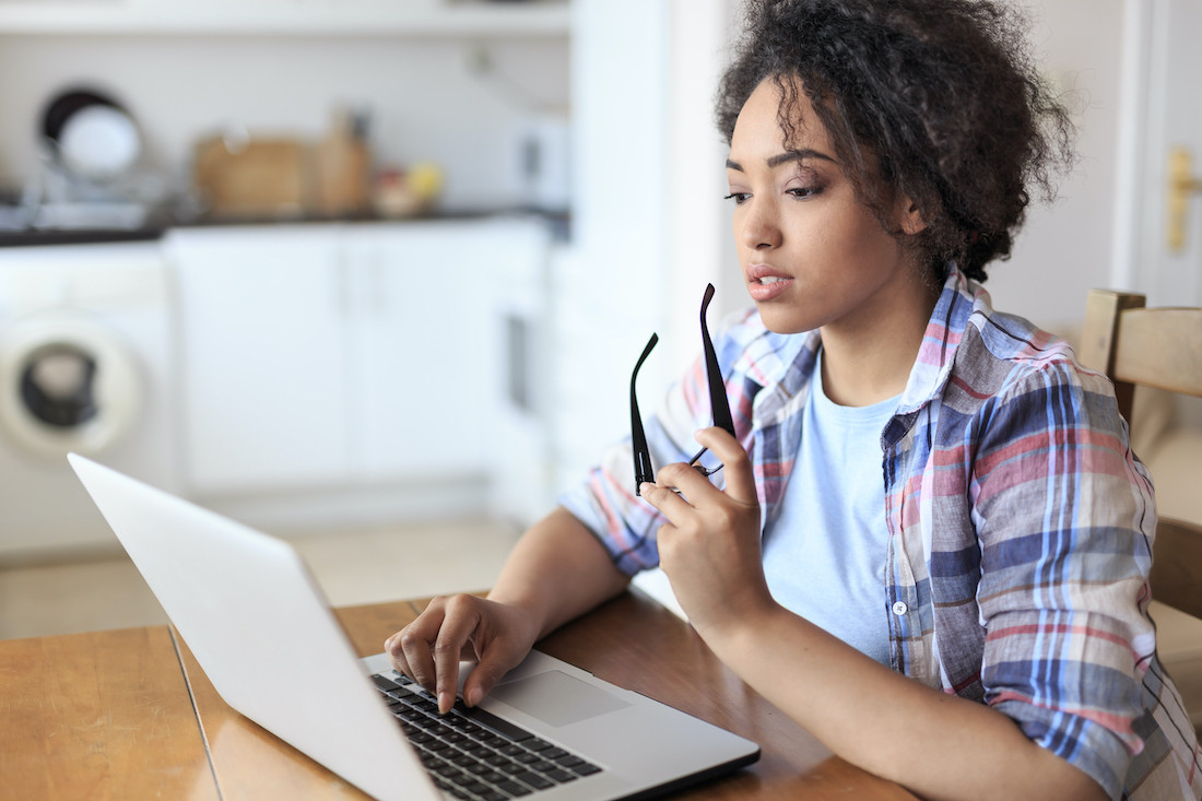 Woman using laptop for online entertainment industry job training