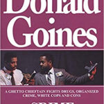 Donald Goines' Crime Partners book cover depicting two Black men in a tense standoff, reflecting themes of crime and partnership.