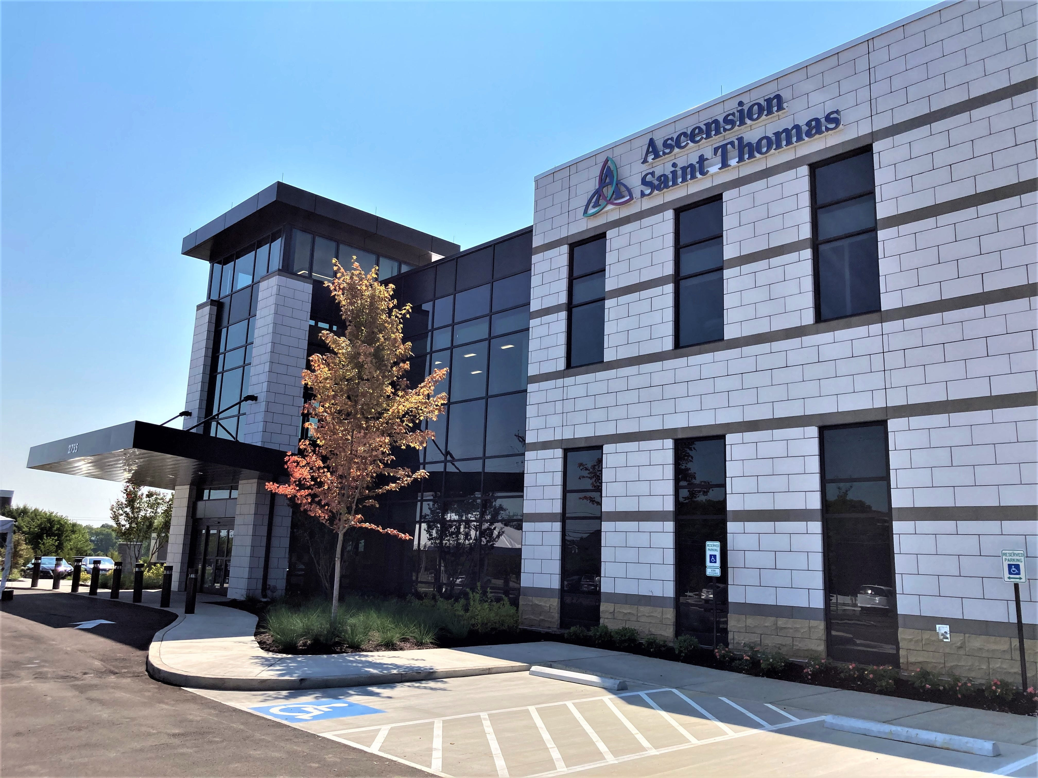 Exterior view of Ascension Saint Thomas New Salem Surgery Center, showcasing modern medical facility design and signage.