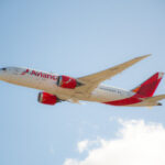 Avianca plane in flight, showcasing partnership benefits