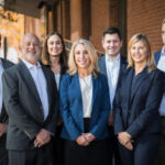 Fortis Law Partners celebrates 10th anniversary with its team of dedicated partners, including (from left to right) David Olsky, Julian Izbiky, Cara Thornton, Julie Herzog, Henry Baskerville, Christine Lamb, and Andrew Comer, highlighting their commitment to legal excellence in Denver.