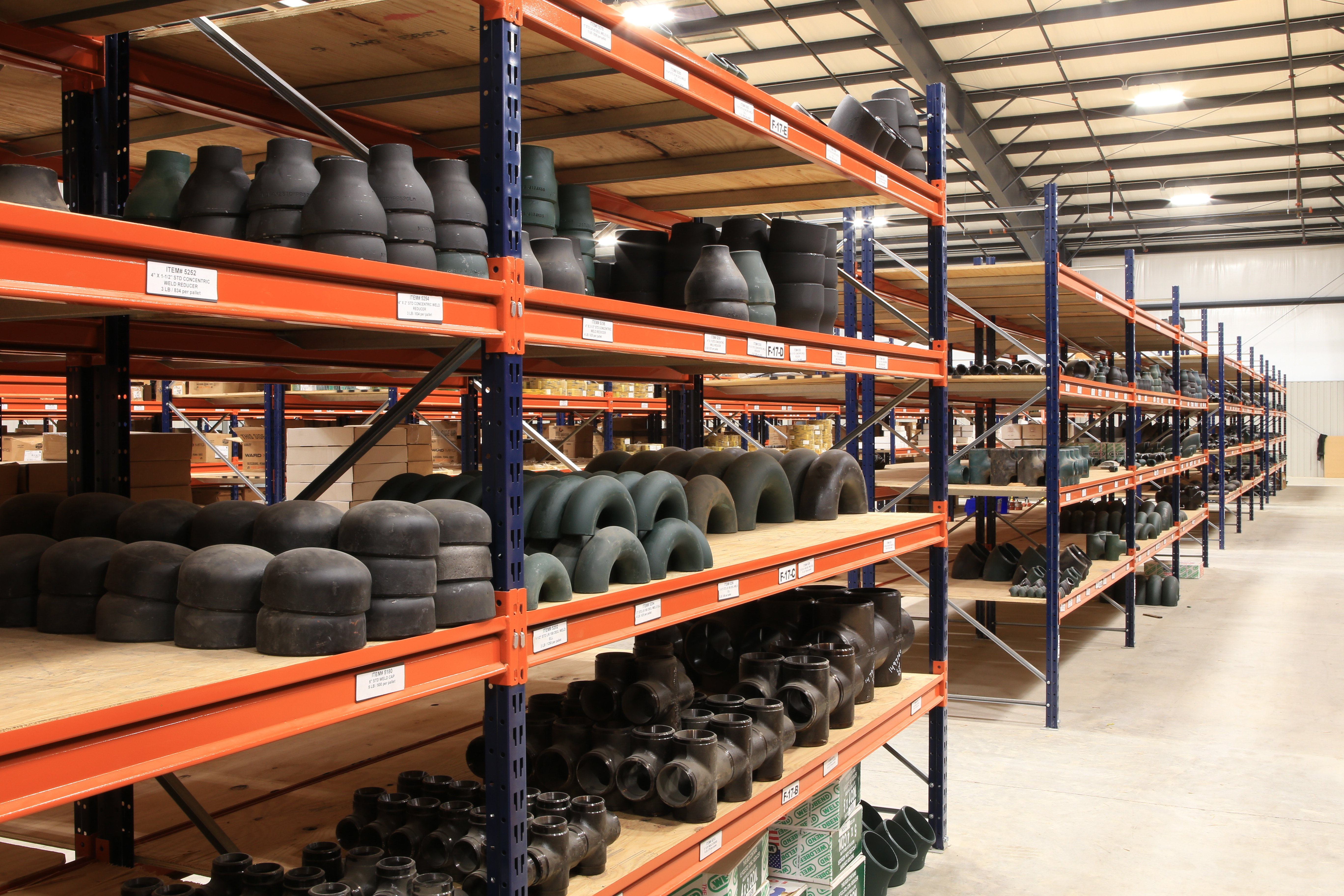 Selection of Industrial Pipe Fittings in a Warehouse Setting