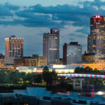 Kelley Commercial Partners logo and office building exterior, showcasing their commercial real estate expertise in Arkansas.