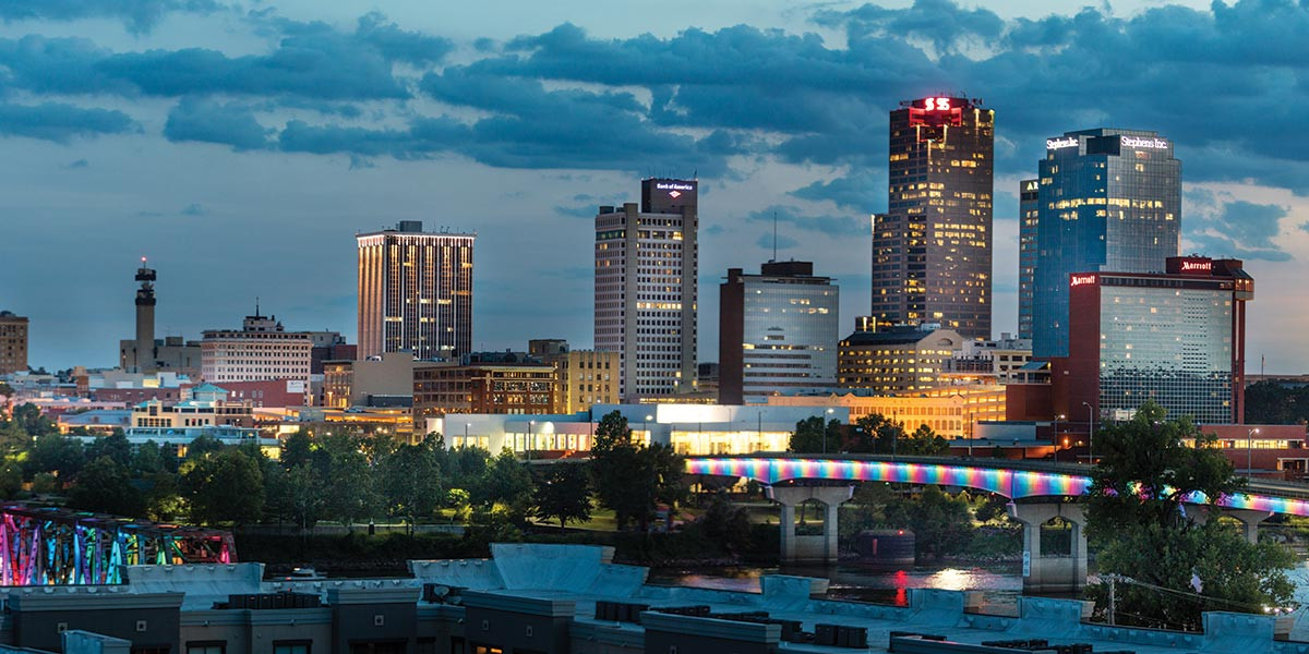 Kelley Commercial Partners logo and office building exterior, showcasing their commercial real estate expertise in Arkansas.