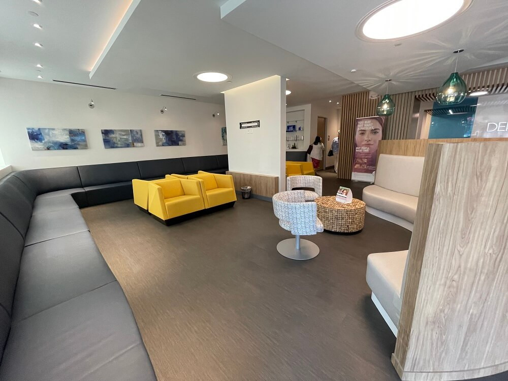 Comfortable seating in the Plano clinic waiting room, promoting a relaxing patient experience.