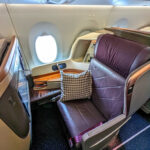 Singapore Airlines Business Class seats on flight SQ24 from Singapore to JFK, showcasing premium cabin comfort.