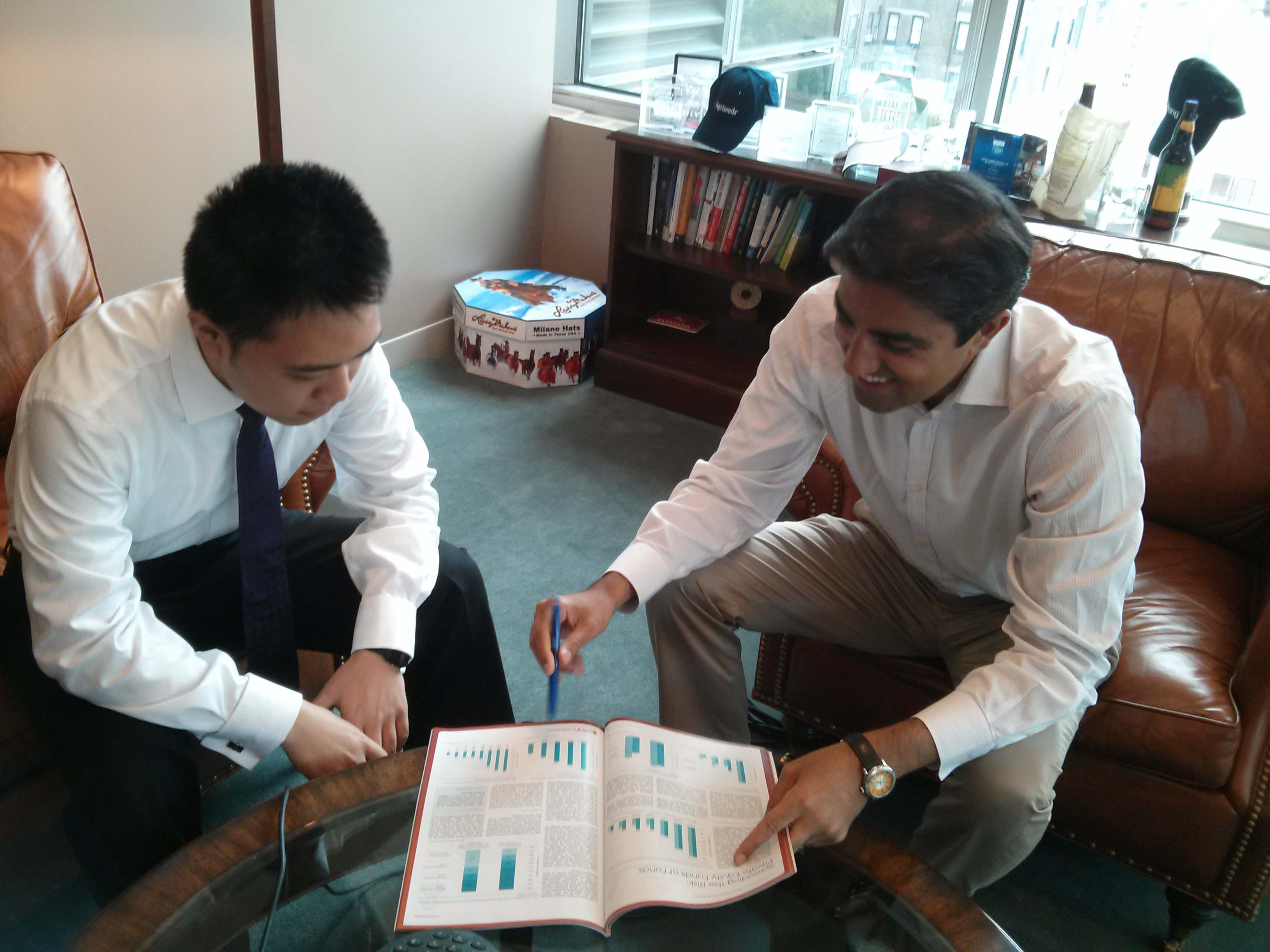 alt text: Weijie Shi posing with Kumber Husain, Senior Vice President at WP Global Partners.