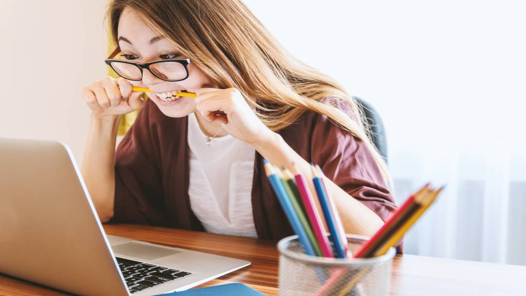 Woman with laptop working on finances