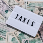 Real estate investors reviewing the numbers for taxes