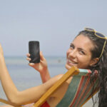 Woman smiling while talking on her phone