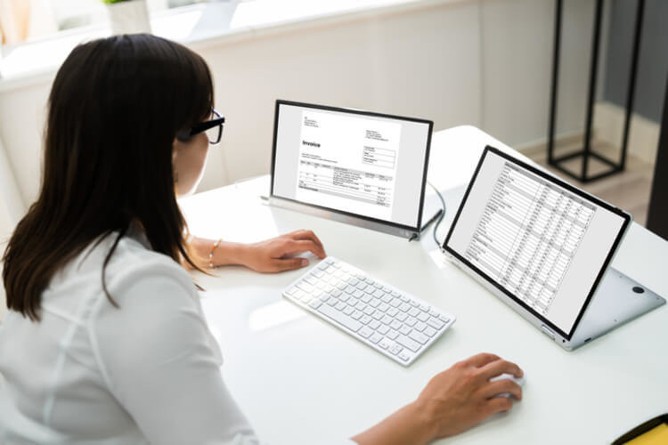 Woman at spreadsheet