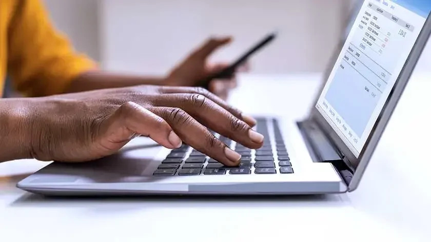 Woman analyzing financial charts on a tablet