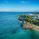 Tropical beach in Antigua and Barbuda, showcasing white sand and clear turquoise water