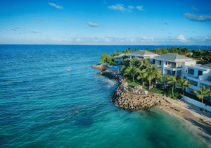 Tropical beach in Antigua and Barbuda, showcasing white sand and clear turquoise water