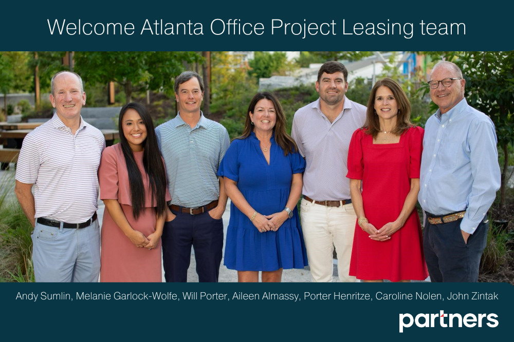 Legal and financial professionals consulting on a partnership agreement in Atlanta