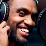 A person is recording audio in a studio