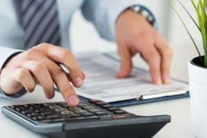 Person Reviewing Rent to Income Ratio on a Computer