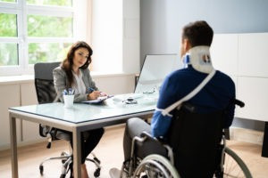Person working on a laptop while receiving disability benefits, illustrating the concept of earned income