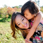 Happy mother and daughter in a park