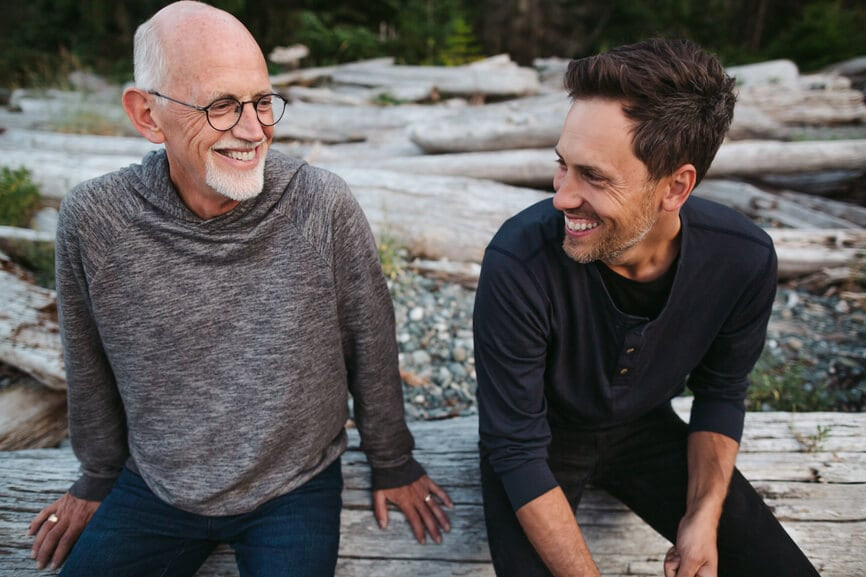 Father helping his son understand financial documents at home