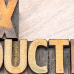 Wooden blocks spell out “Tax Deductible