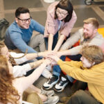 Man reaching out to shake hands in a business setting