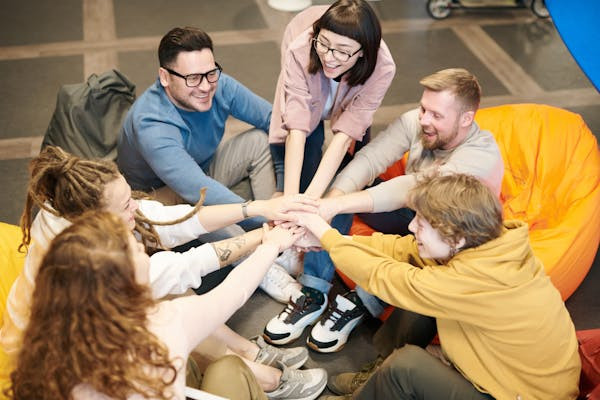 Man reaching out to shake hands in a business setting