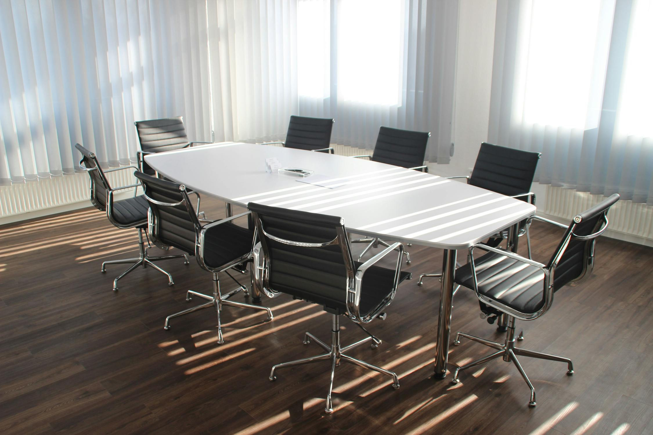 A diverse group of professionals collaborating around a table, symbolizing teamwork and partnership