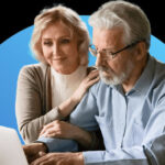 Couple reviewing information on laptop together