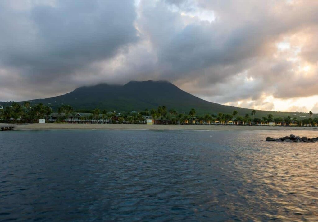 Scenic view of St. Kitts and Nevis, showcasing lush green landscapes and a calm blue sea