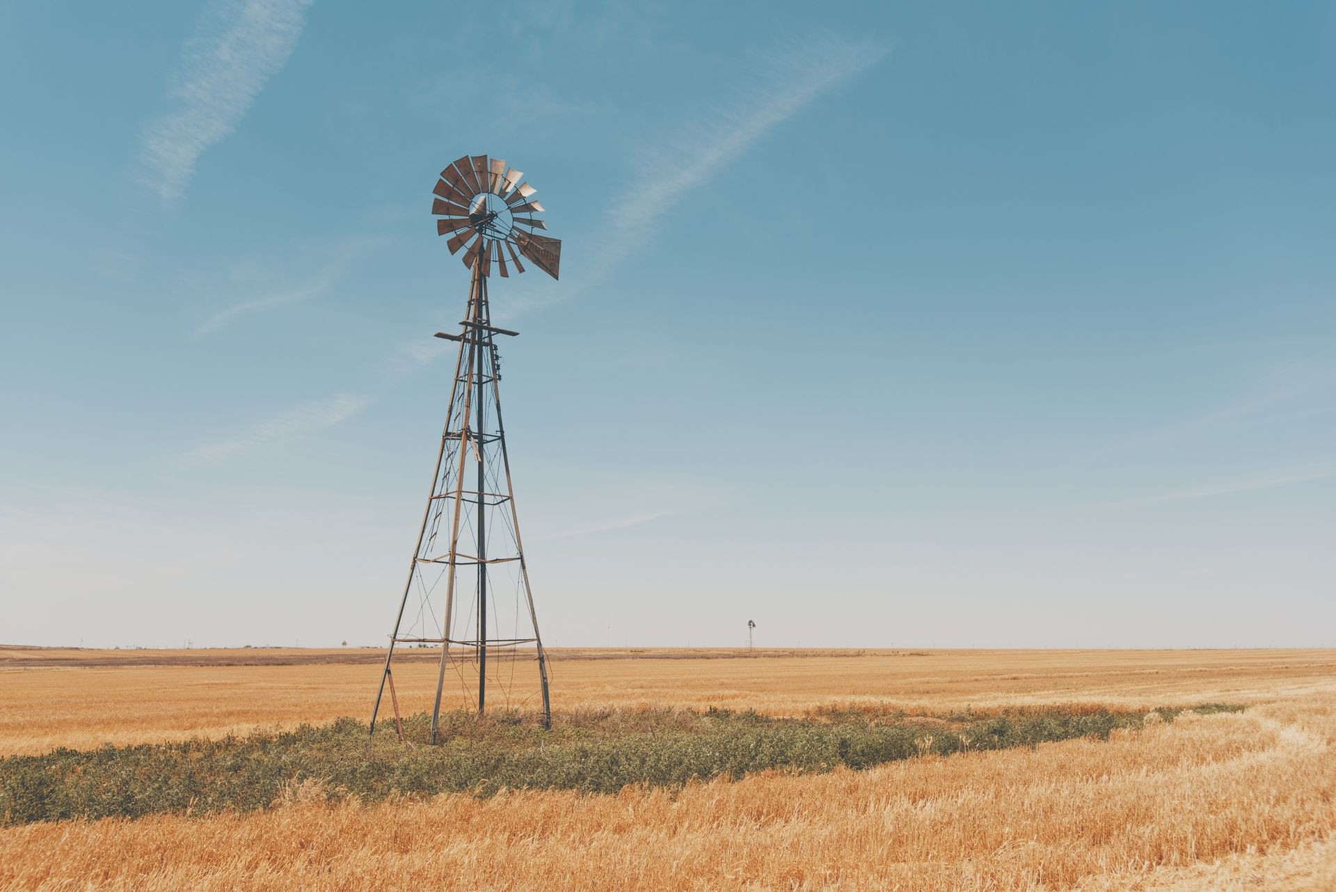 Texas landscape with a tall windmill