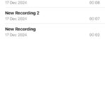 Record calls on an iPhone with voice memos. The phone shows the red record button to start the recording.