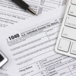 Standard deduction illustration with a calculator and tax form