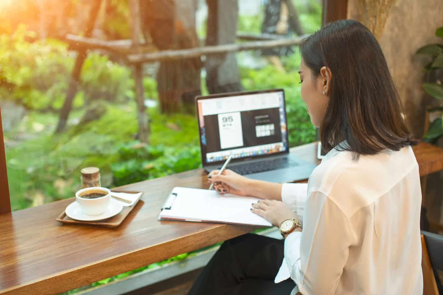 photo of woman writing a letter