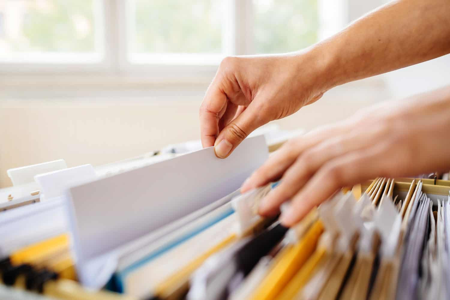 photo of someone filing their lease