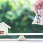 money-house-seesaw-IS-1048402108