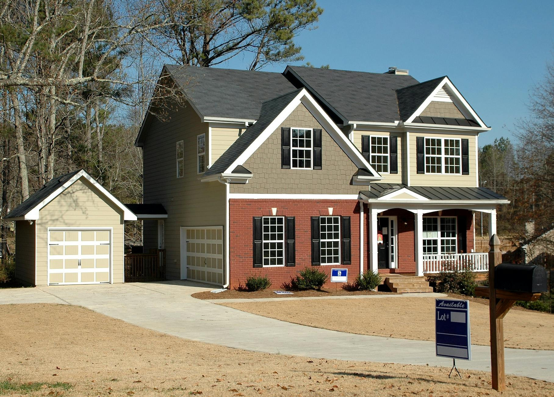 House with a SOLD sign in front of it, indicating success in property sales and real estate investments