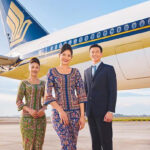 Airline industry leaders discussing customer experience strategies at a conference