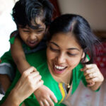 Nanny and child playing
