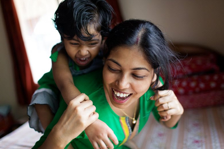 Nanny and child playing