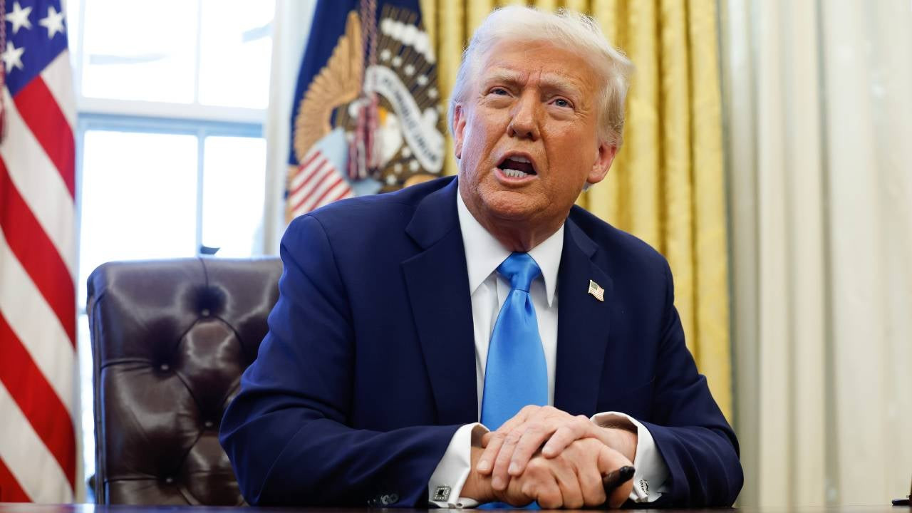 American President, Donald Trump, at his office desk