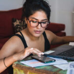A woman calculates taxes.