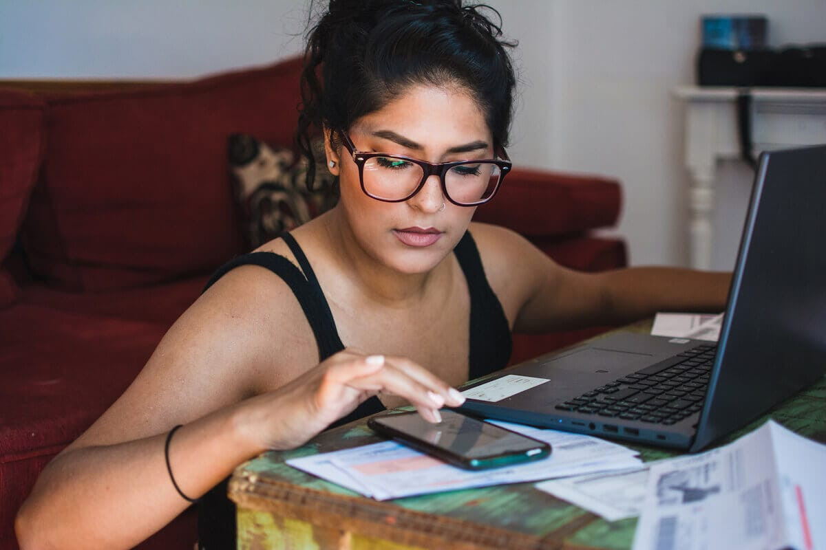 A woman calculates taxes.